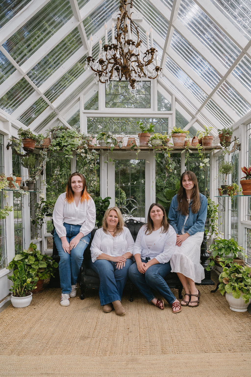 mother and daughters in greenhouse located on Sharp Farm in Swartz Creek Michigan