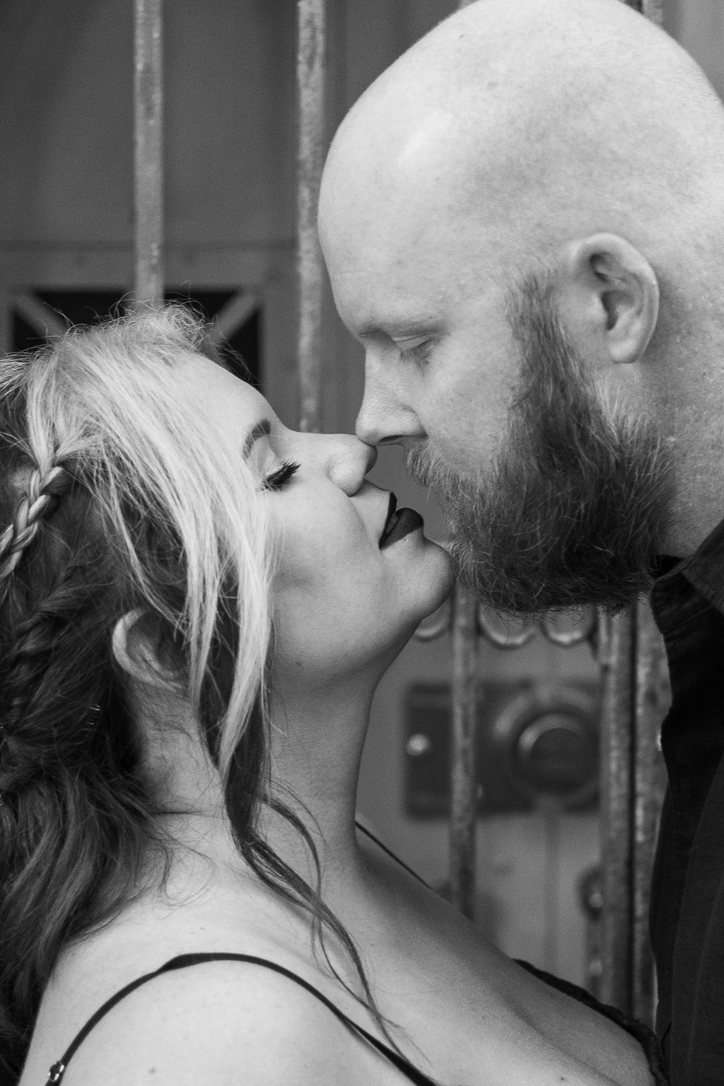 engaged couple in front of cemetery in Pontiac, Michigan