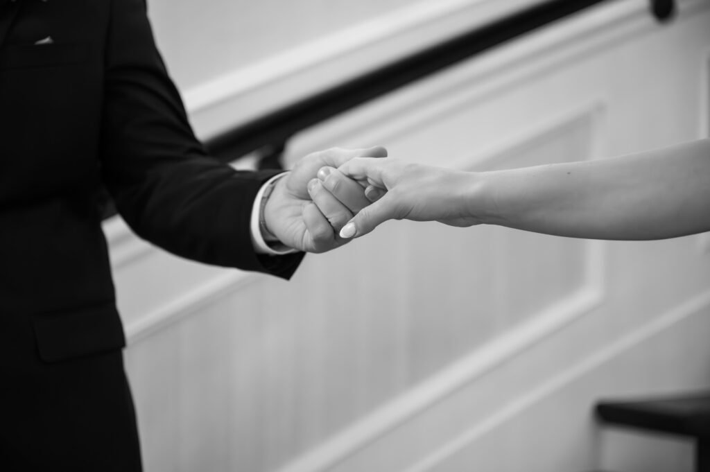 close up photo of bride and groom's hands in The Palazzo Grande, a Sterling Heights Michigan wedding venue