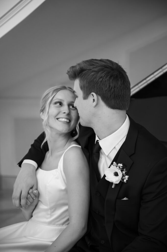 bride and groom sitting next to each other at The Palazzo Grande, a wedding venue in Sterling Heights Michigan