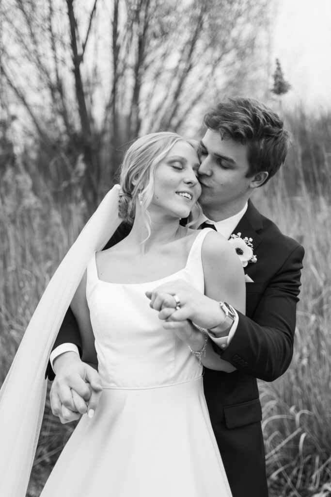 bride and groom dancing in open field at The Palazzo Grande in Sterling Heights Michigan