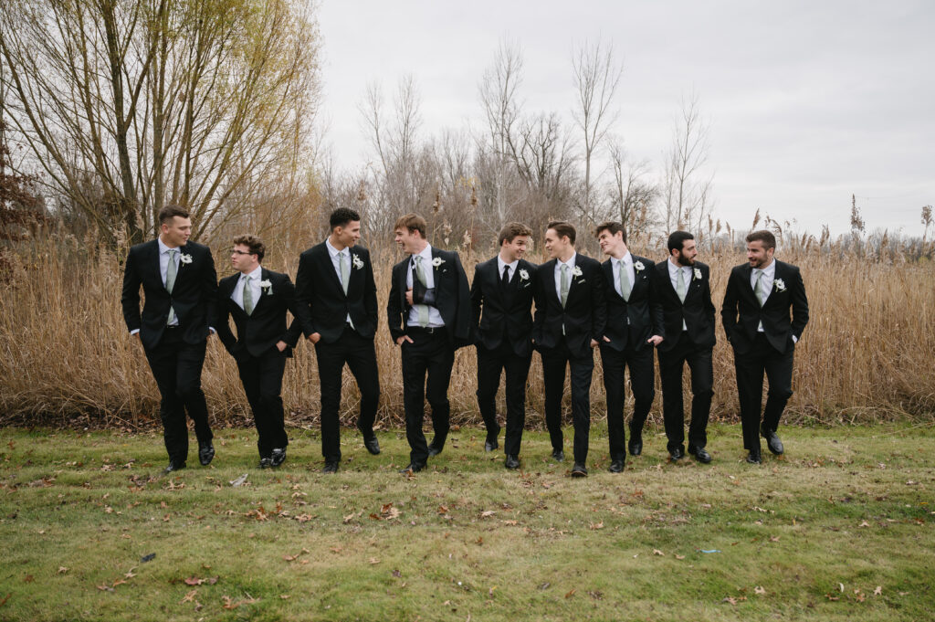 groomsmen walking to The Palazzo Grande, a wedding venue in Sterling Heights Michigan