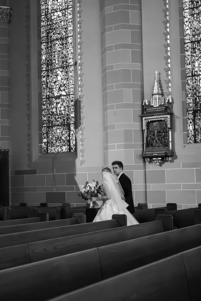 bride and groom walking through St Florian Catholic Church, located in Detroit Michigan