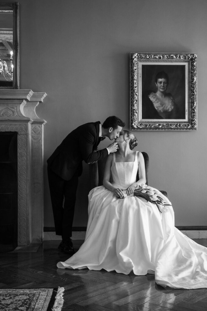 bride and groom kissing inside michigan wedding venue