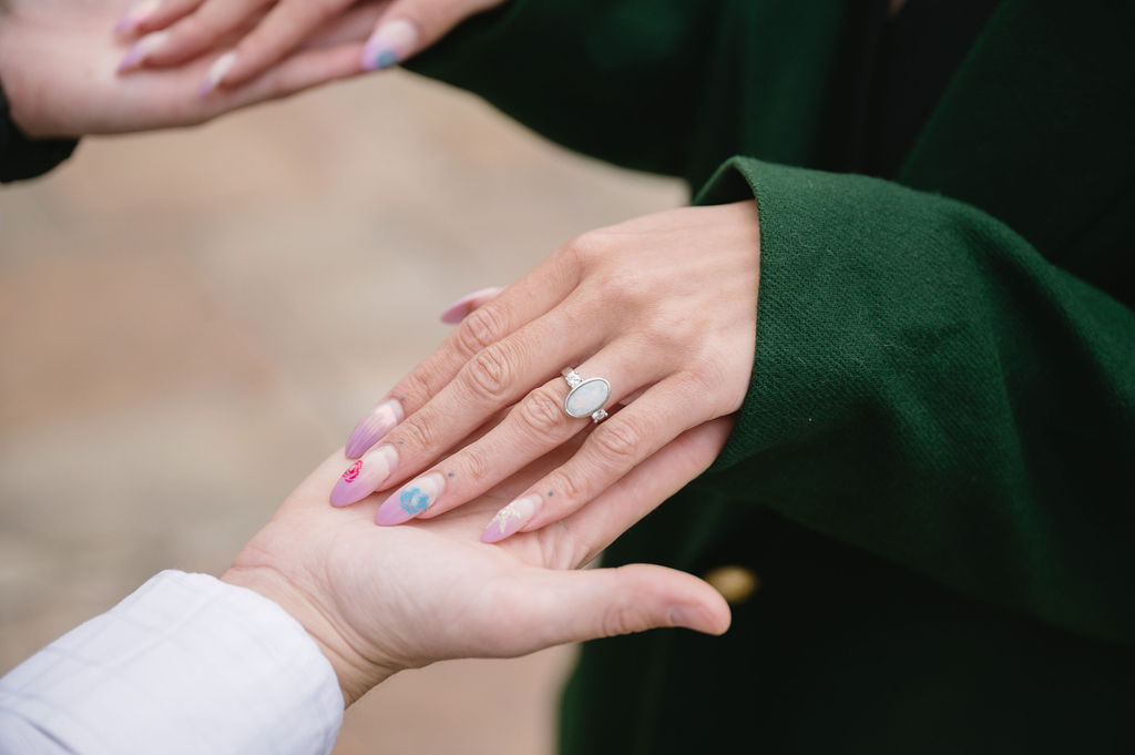 close up photo of engagement ring outside Meadowbrook Hall, a Rochester Michigan wedding venue