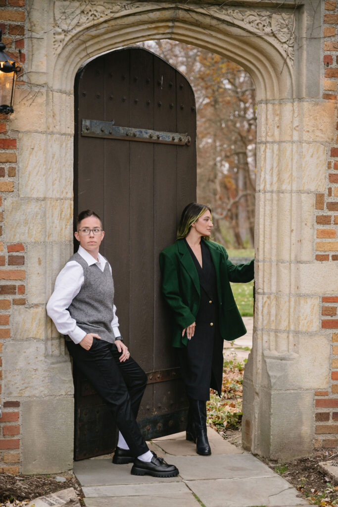 engaged couple standing outside of Meadowbrook Hall, a wedding venue in Rochester Michigan