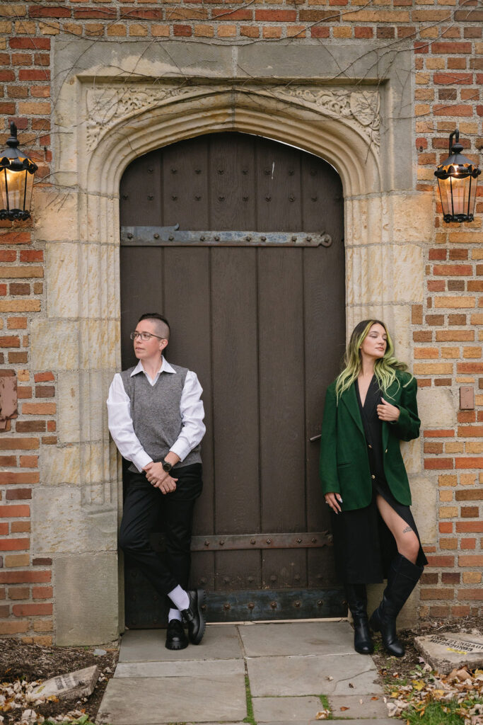 engaged couple standing outside of Meadowbrook Hall, a wedding venue in Rochester Michigan