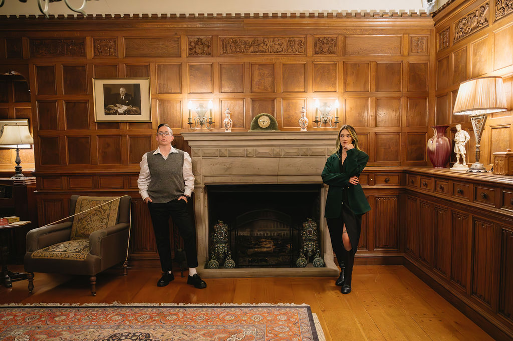 engaged couple standing inside study of Meadowbrook Hall, a Rochester Michigan wedding venue