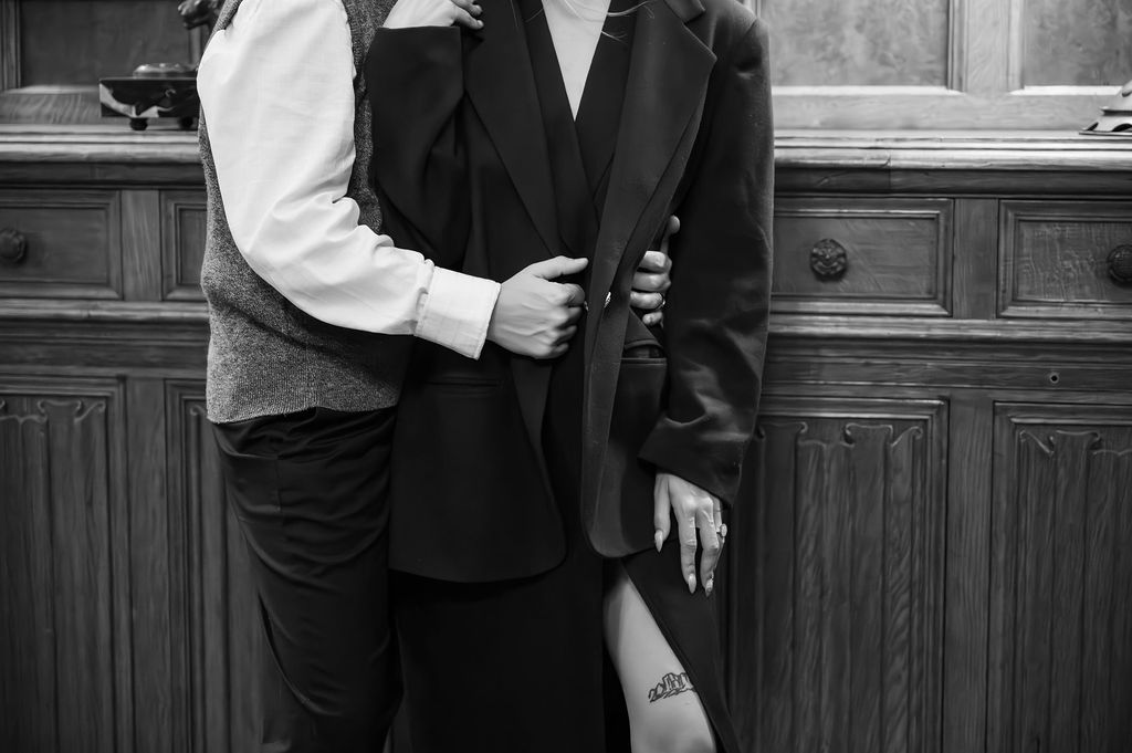 engaged couple standing inside study of Meadowbrook Hall, a Rochester Michigan wedding venue