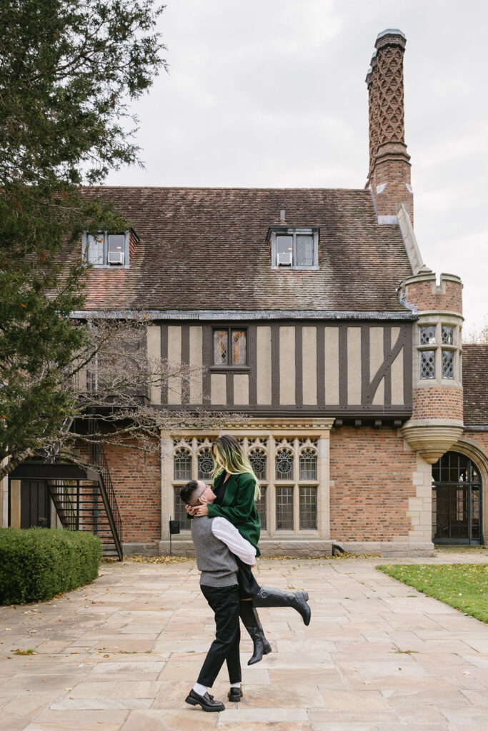 engaged couple dancing outside of Meadowbrook Hall, a wedding venue in Rochester Michigan