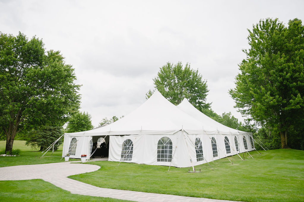 tented wedding reception space at golf course