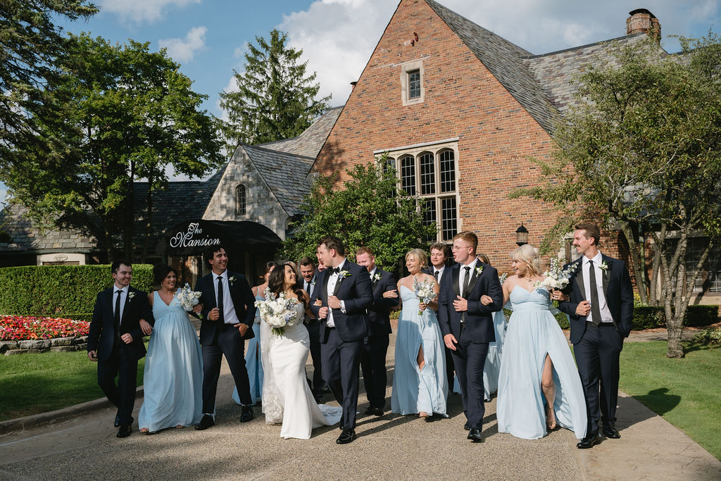couple walking in front of golf course wedding venue