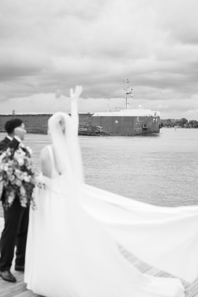 bride and groom waving at freighter
