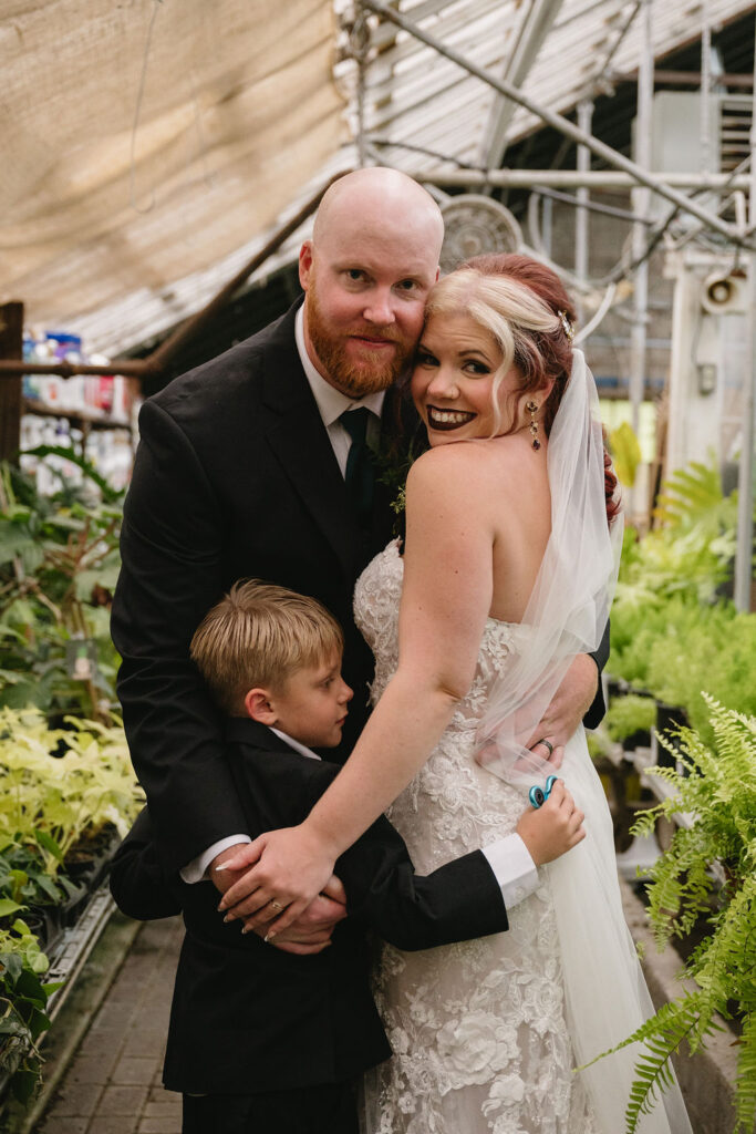 bride and groom inside Goldner Walsh greenhouse