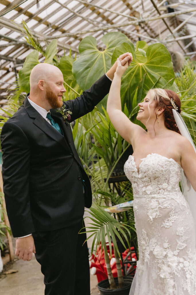 bride and groom dancing in Goldner Walsh greenhouse