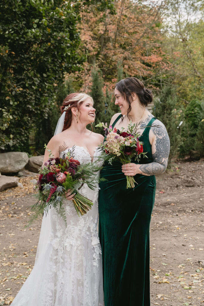 bride and bridesmaid looking at each other