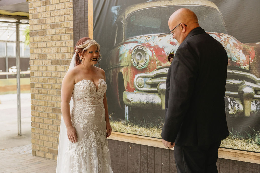 bride and father first look in greenhouse