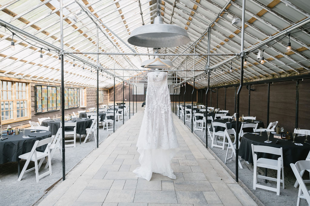 wedding gown hanging from venue rafters