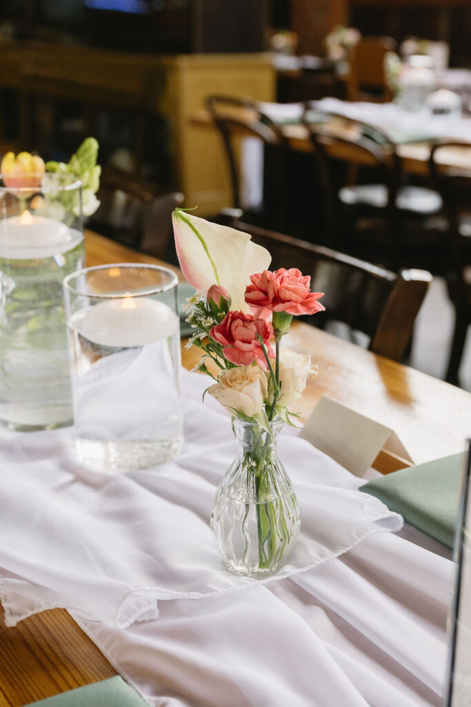 pink floral decor at wedding venue
