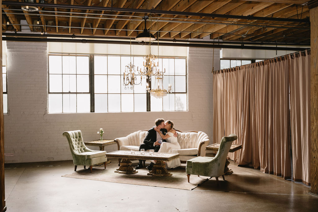 bride and groom kissing inside the cheney place in grand rapids michigan