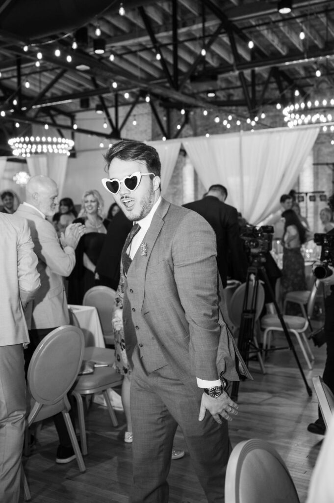 wedding party grand entrance with sunglasses in the high five grand rapids