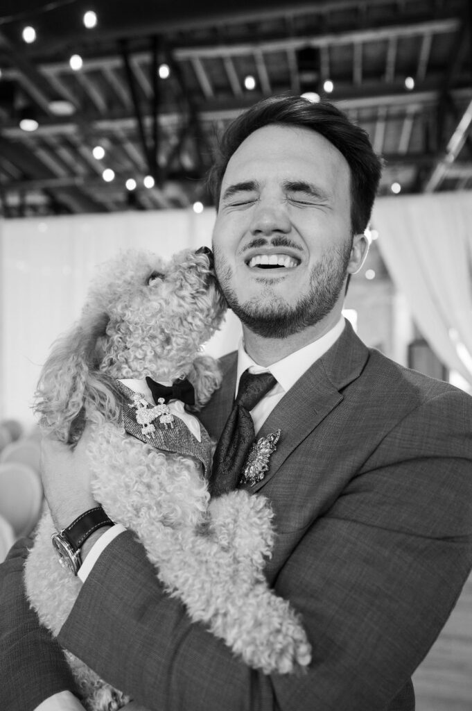 groom holding dog inside high five grand rapids venue