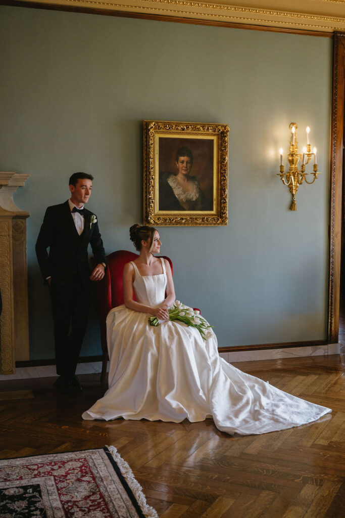 bride and groom inside Alger House library