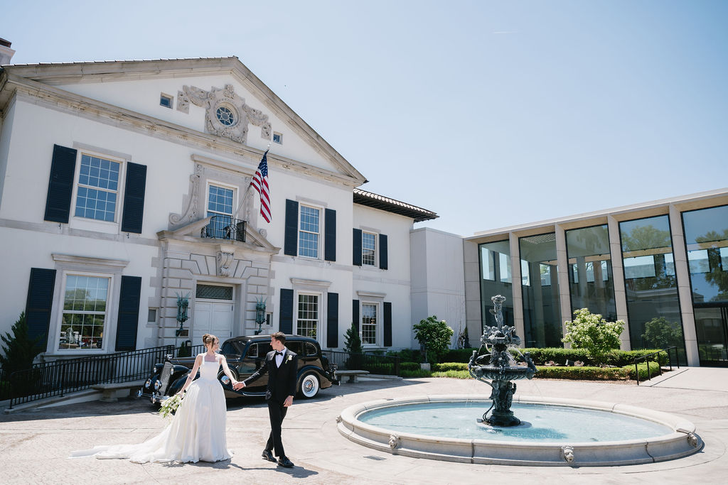 bride and groom walking in front of the War Memorial