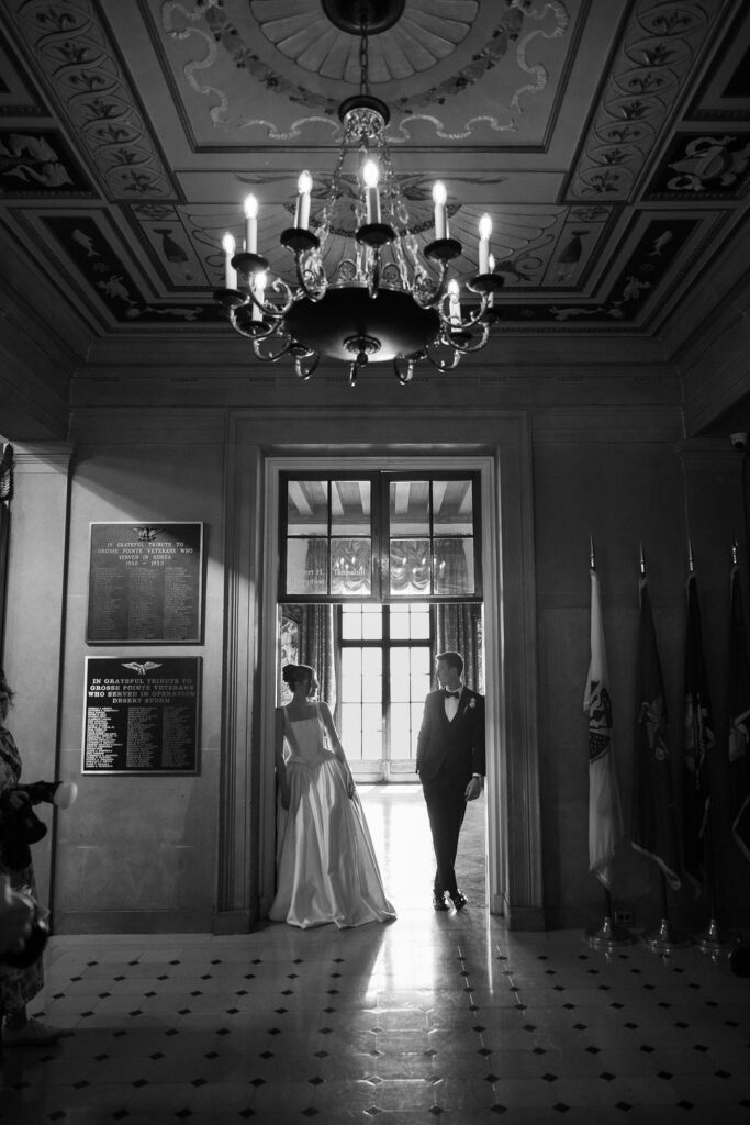 bride and groom standing inside Alger House, part of the War Memorial 