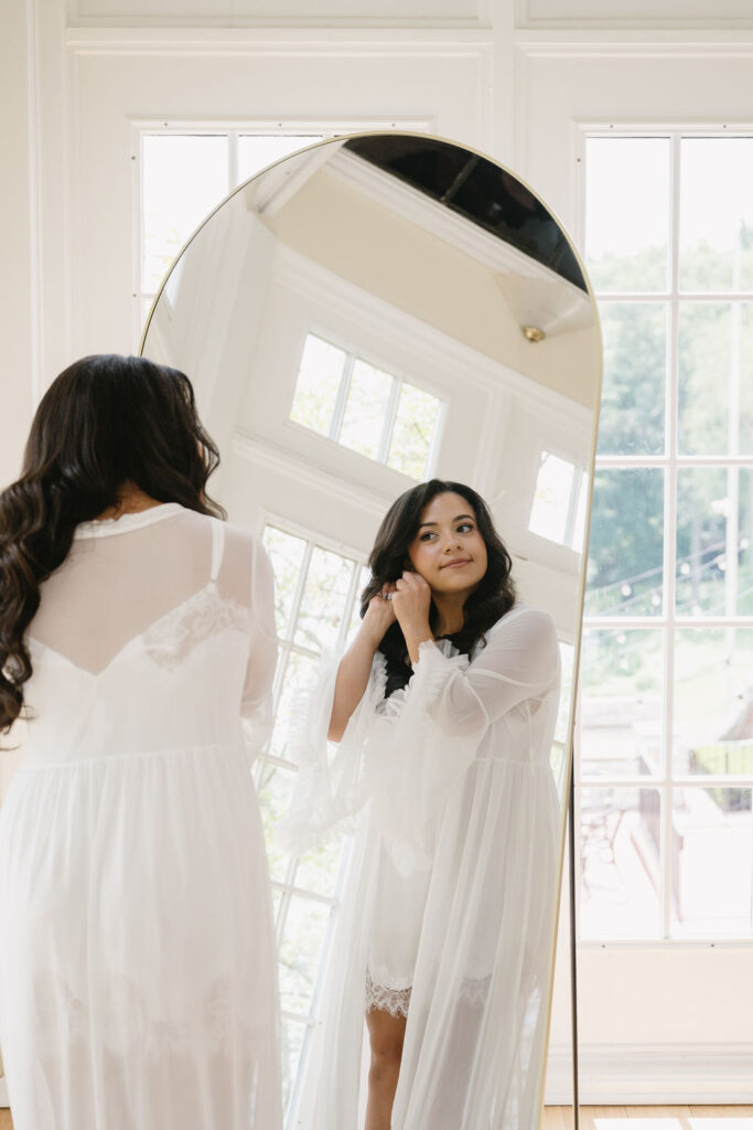 bride getting ready in bridal suite
