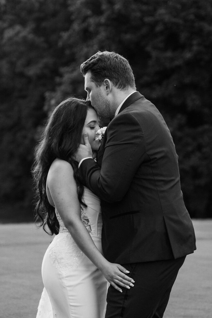 couple kissing on golf course