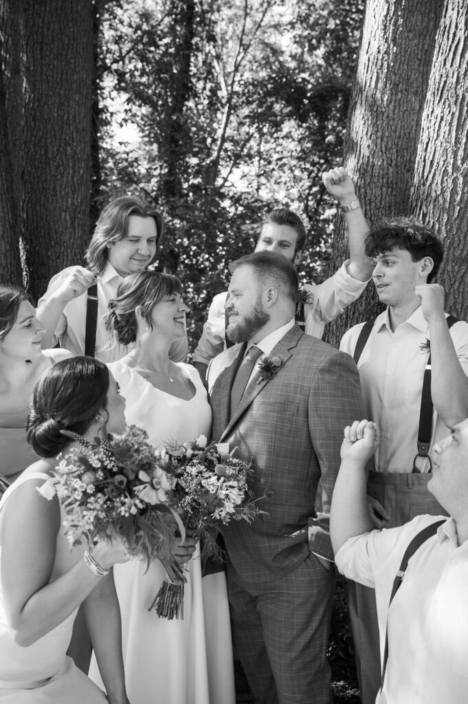 bride and groom with wedding party