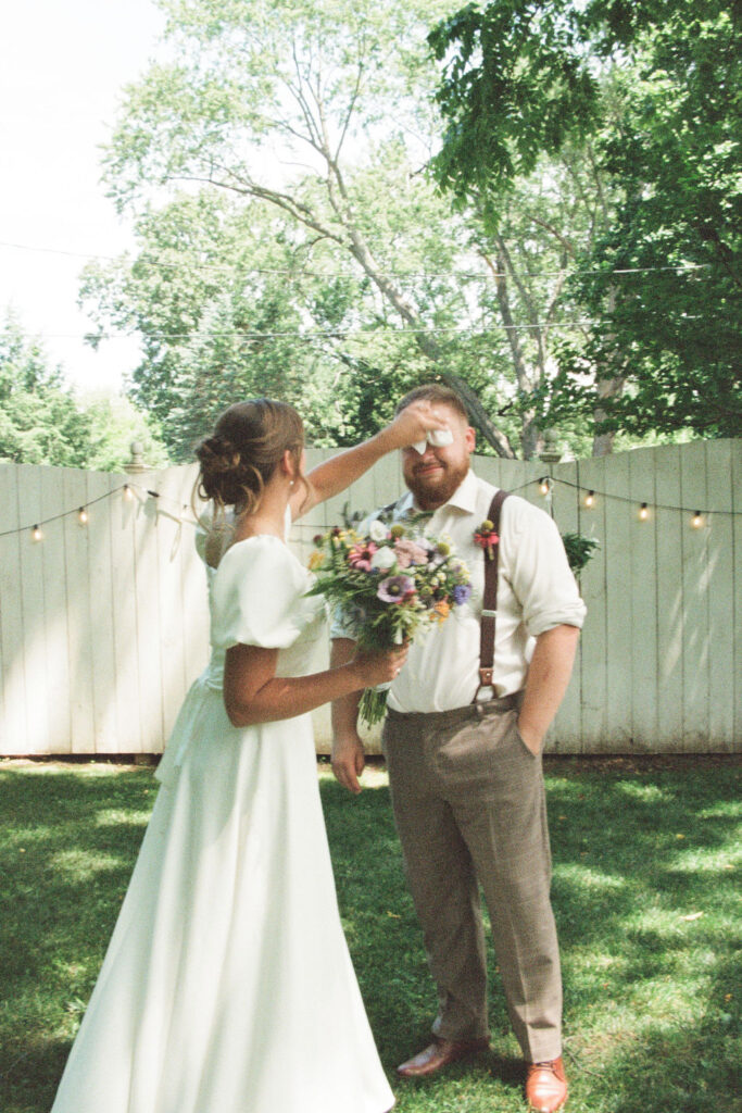 bride wiping groom's face