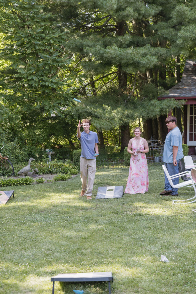 wedding guests playing cornhole