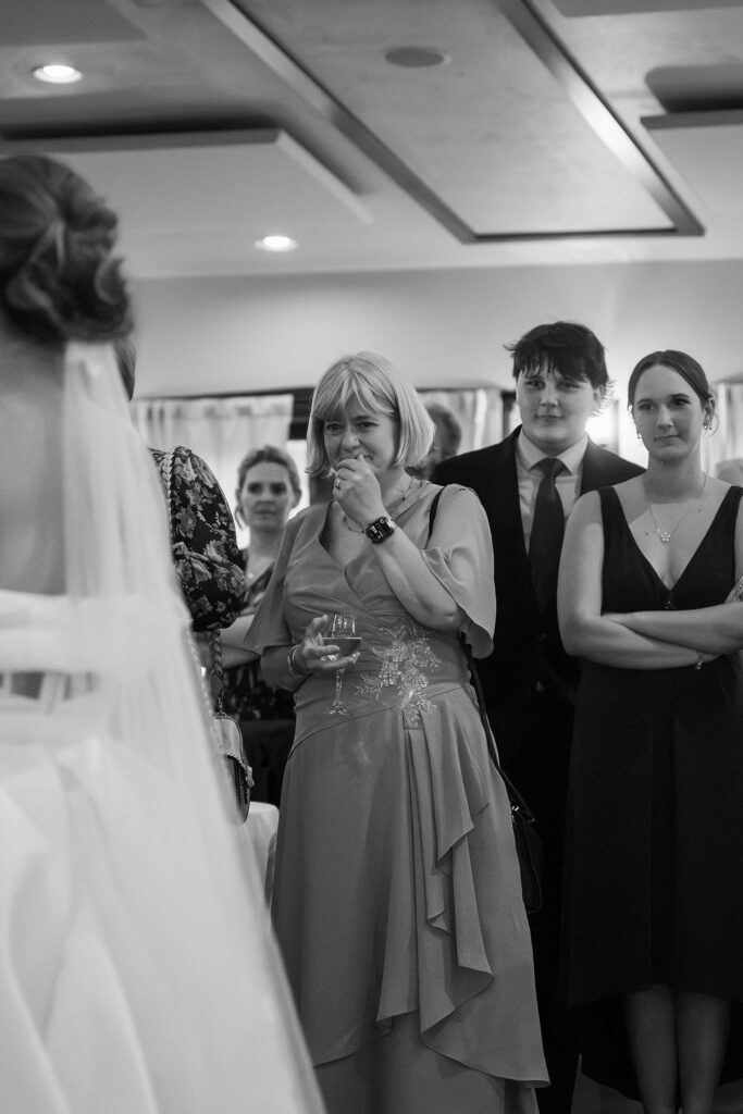 mom crying while watching father daughter dance