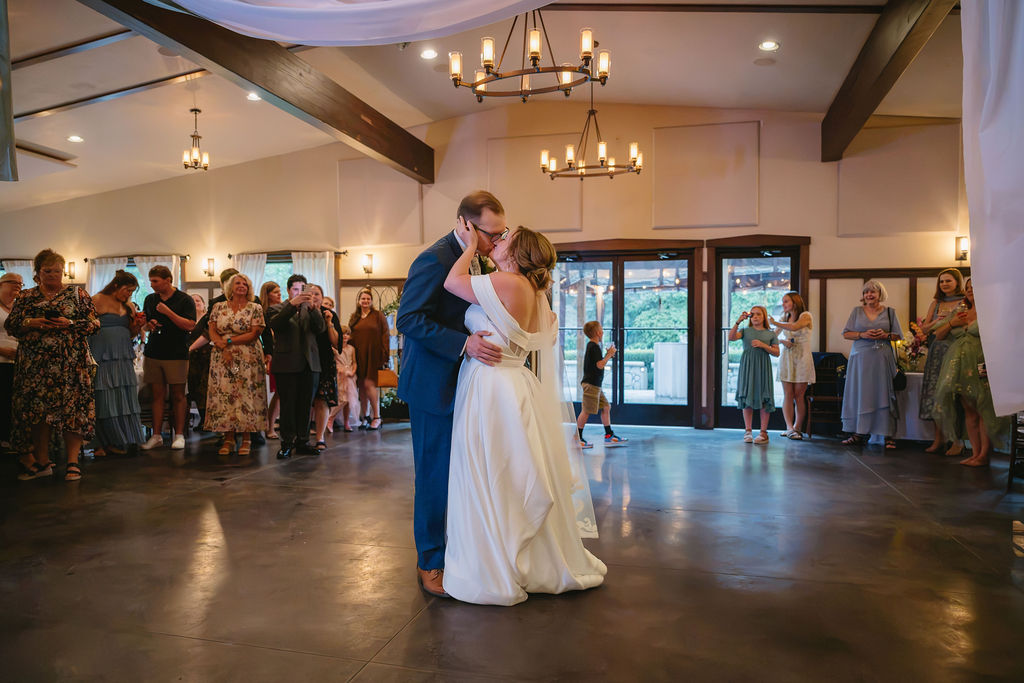 bride and groom having first dance inside the peninsula room wedding venue