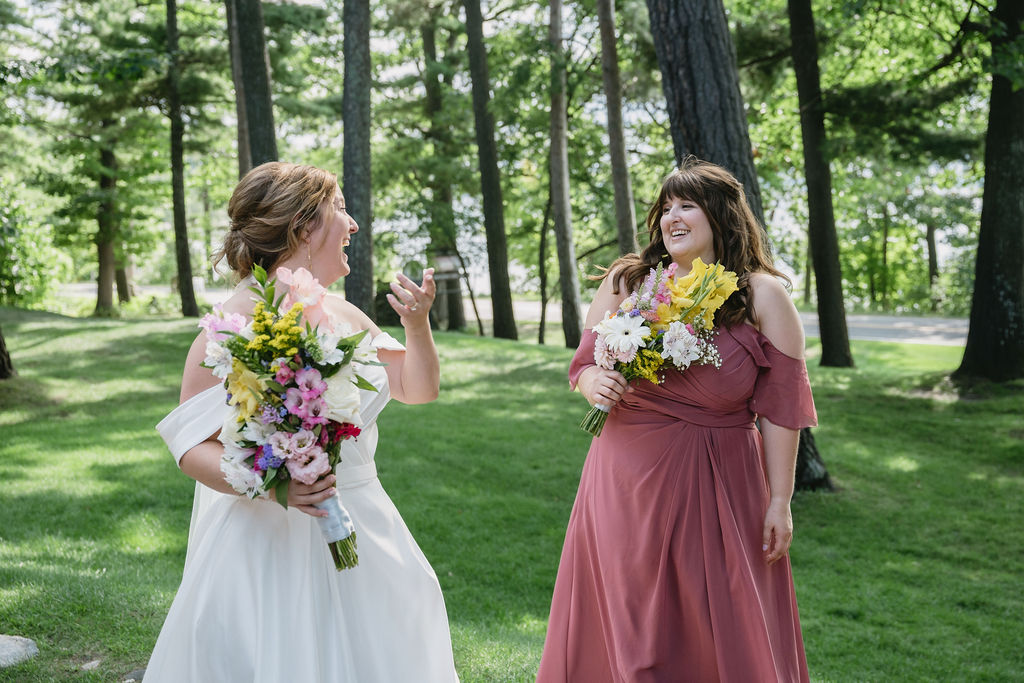 bride laughing with bridesmaid