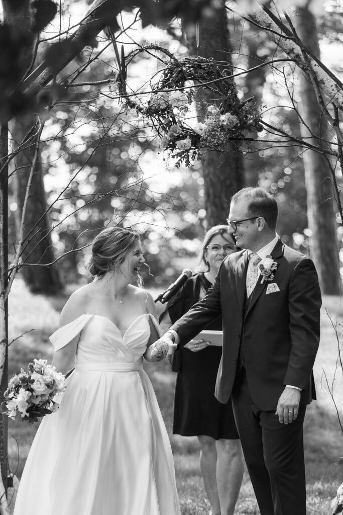 bride and groom looking at one another during wedding ceremony at the peninsula room