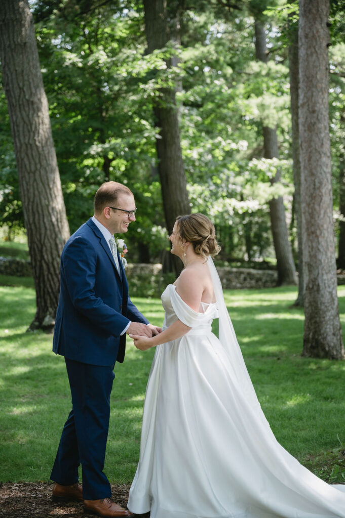 bride and groom chatting with one another outdoors