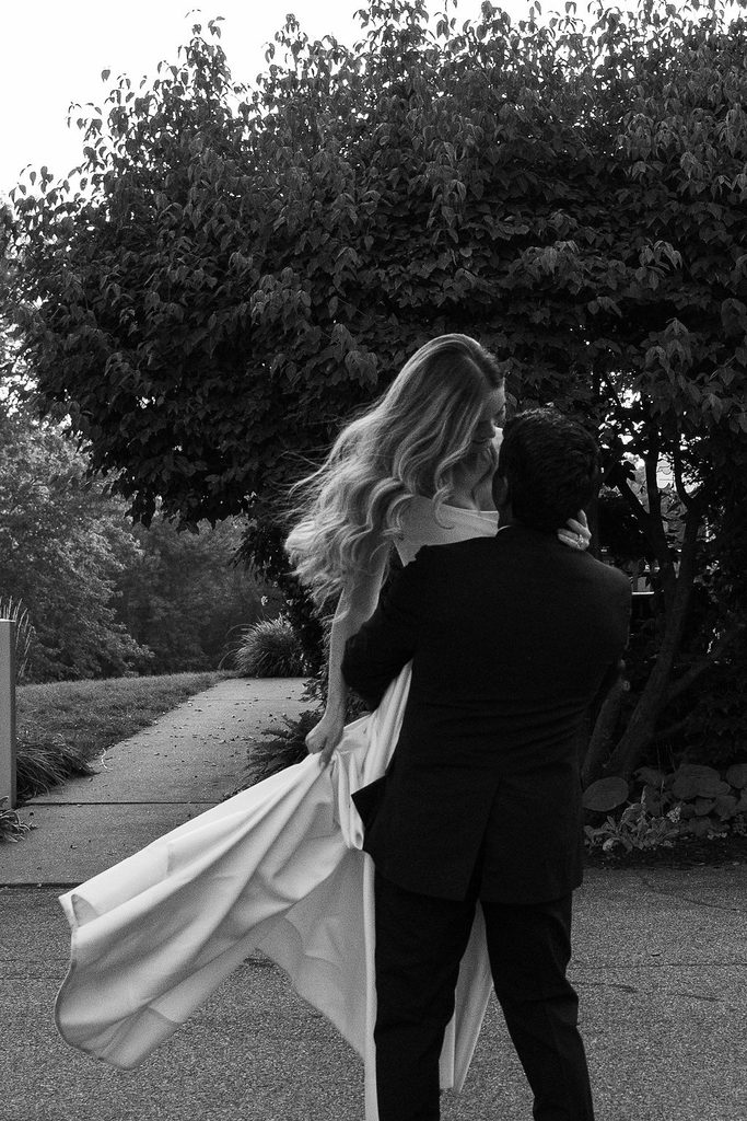 groom twirling bride around
